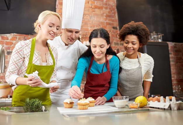 Smiling students in a kitchen